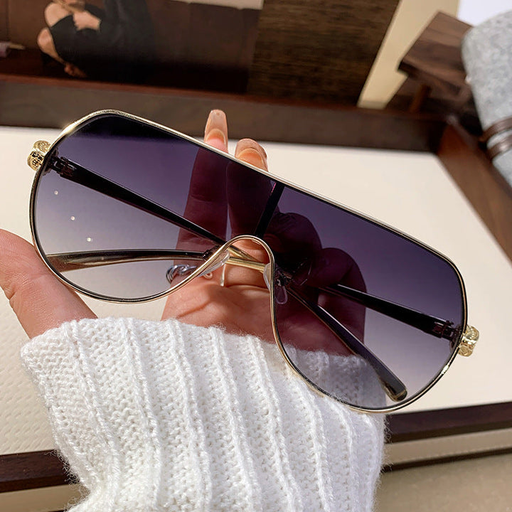 Stylish metal frame women's oversized aviator sunglasses, providing chic style and vital UV protection.