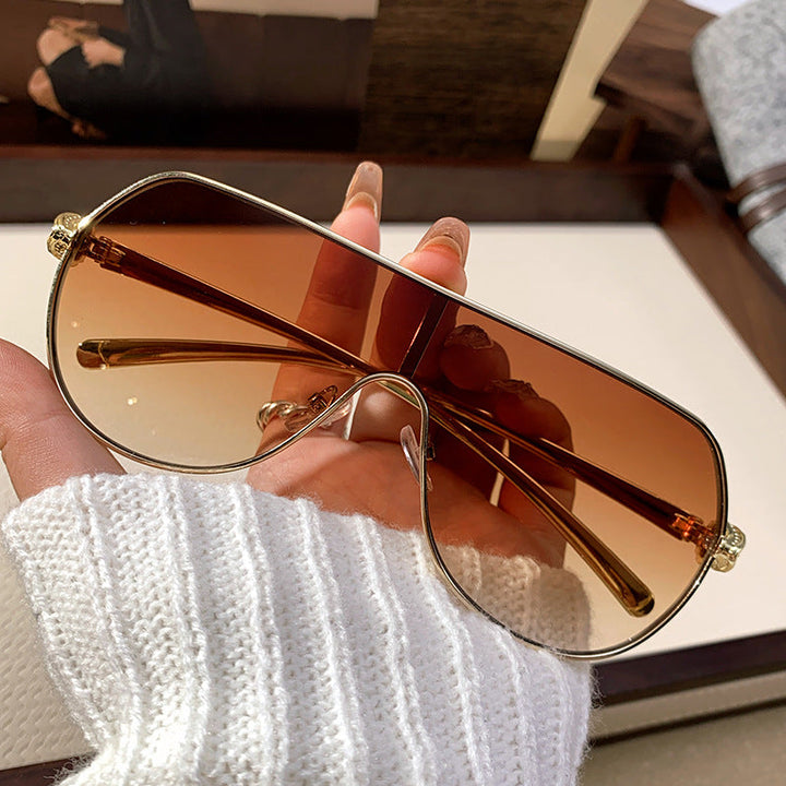 Chic women's oversized aviator sunglasses, modern design and UV protective lenses, perfect fashion eyewear.