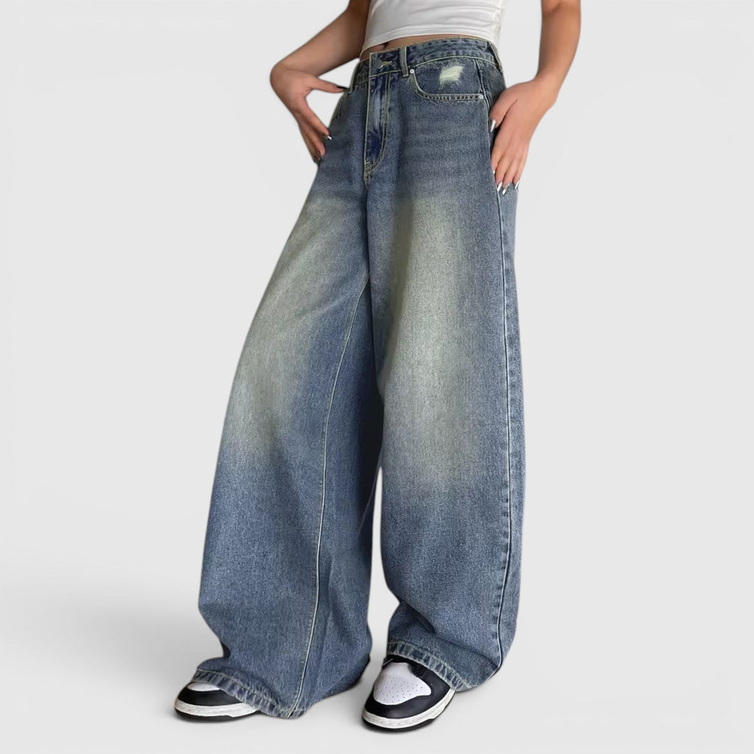 Women's loose fit baggy pants, oversized and floor length, offering a relaxed and comfortable style.