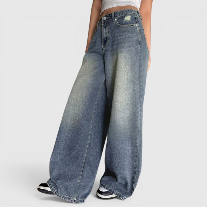 High-waisted women's wide leg pants, oversized loose fit, floor length for a modern baggy look.