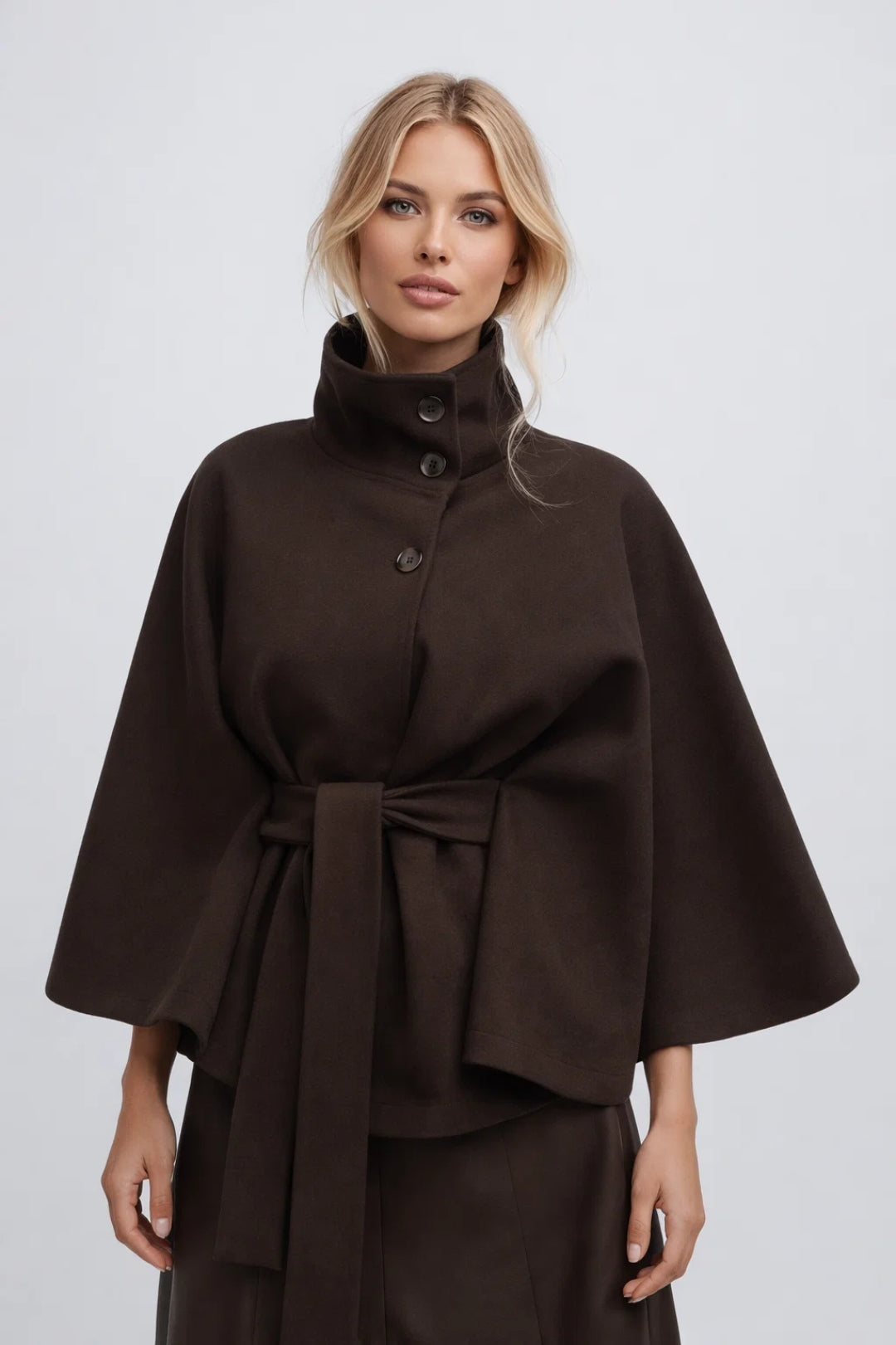 Chic transitional outerwear: women's belted short coat with a sophisticated high collar.