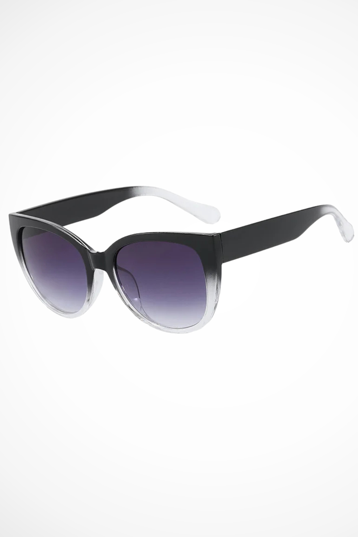 Chic women's oversized cat eye sunglasses with stylish gradient lenses, perfect for a fashionable look.