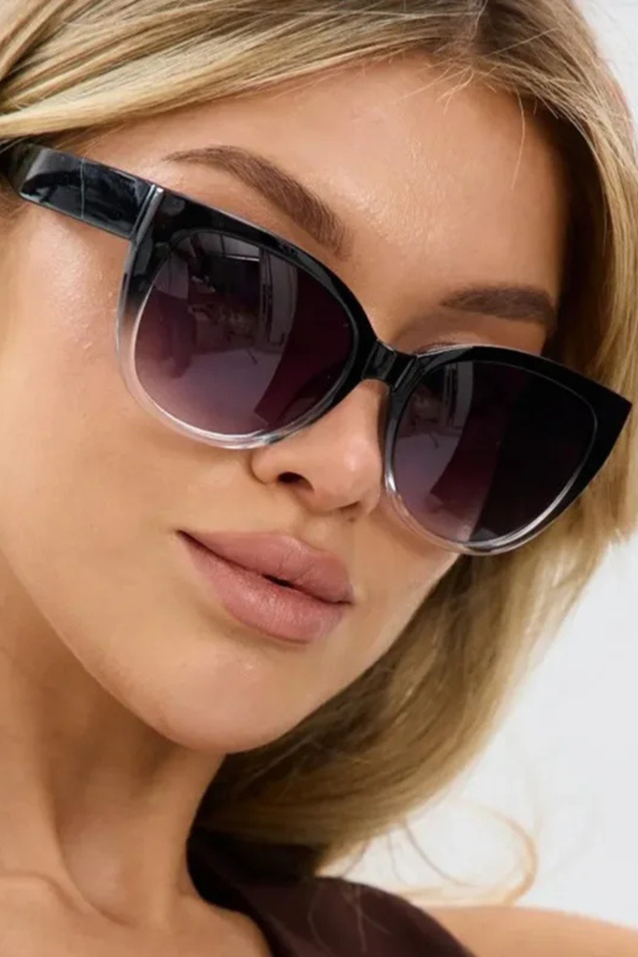 Black oversized cat-eye sunglasses for women, featuring trendy gradient tinted lenses for a chic look.