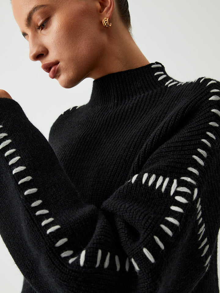 Relaxed fit women's oversized sweater in black with stylish contrast stitches, perfect for everyday comfort & fall outfits.