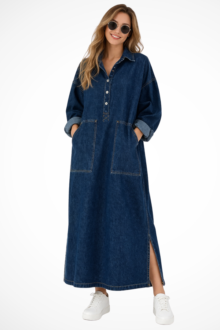 Women's oversized blue denim maxi dress with collared neckline, long sleeves, and practical pockets, perfect for casual wear.