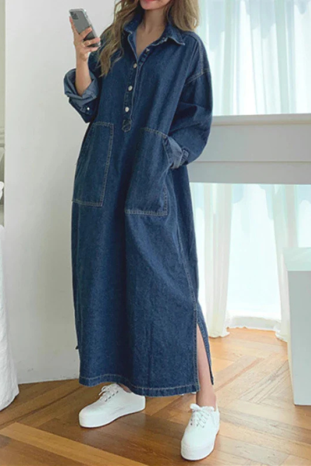 Blue denim maxi dress for women, featuring an oversized fit, collared neckline, long sleeves, and functional pockets. Casual style.