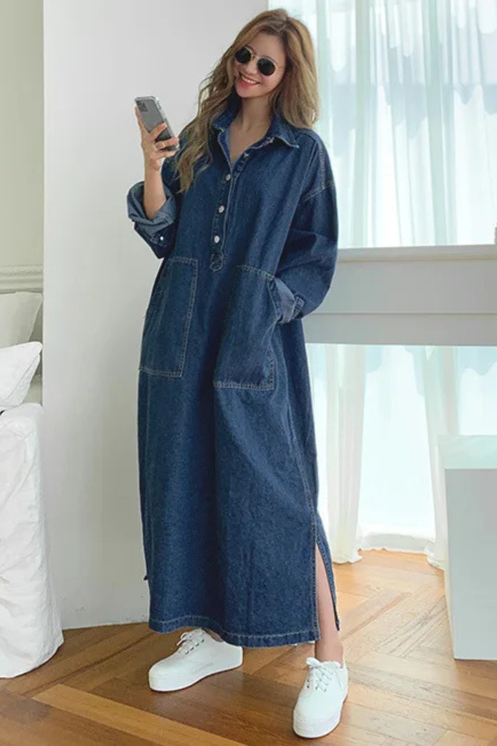 Relaxed fit women's collared denim maxi dress. Oversized blue long sleeve design with practical pockets for ultimate comfort.