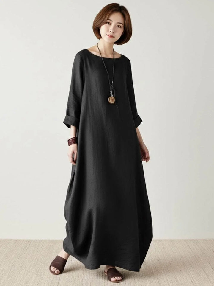 Women's oversized batwing sleeve maxi dress, bohemian style, ideal for laid-back summer days.
