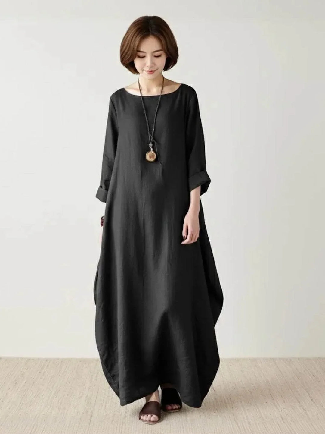 Flowy bohemian maxi dress for women, loose fit, 3/4 batwing sleeves, perfect casual wear.