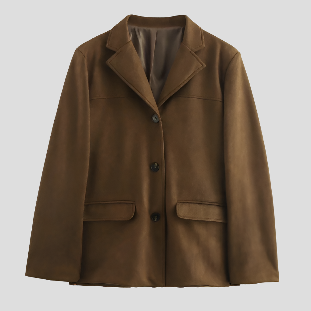 Women's oversized brown trench coat with wide lapel. Elegant, long outerwear for autumn/winter fashion.