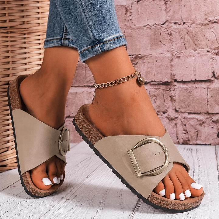 Women's oversized buckle slide sandals for ultimate summer comfort. Trendy slip-on footwear for beach and casual wear.