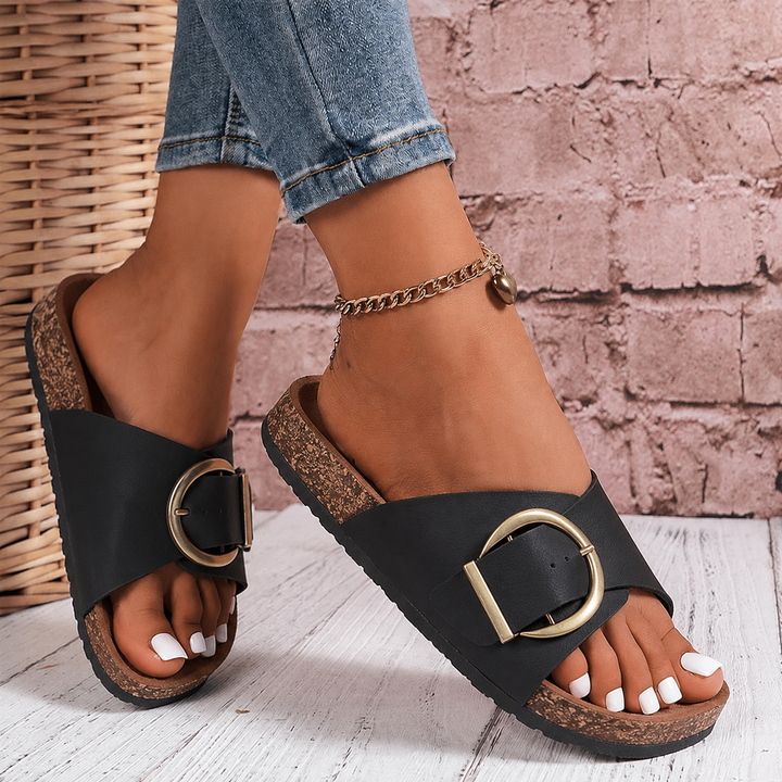 Slip-on women's oversized buckle slide sandals in a neutral tone. Ideal for summer comfort, beach trips, and casual style.