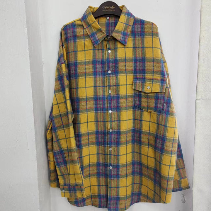 Fashionable women's oversized plaid shirt, a stylish and comfortable everyday blouse.