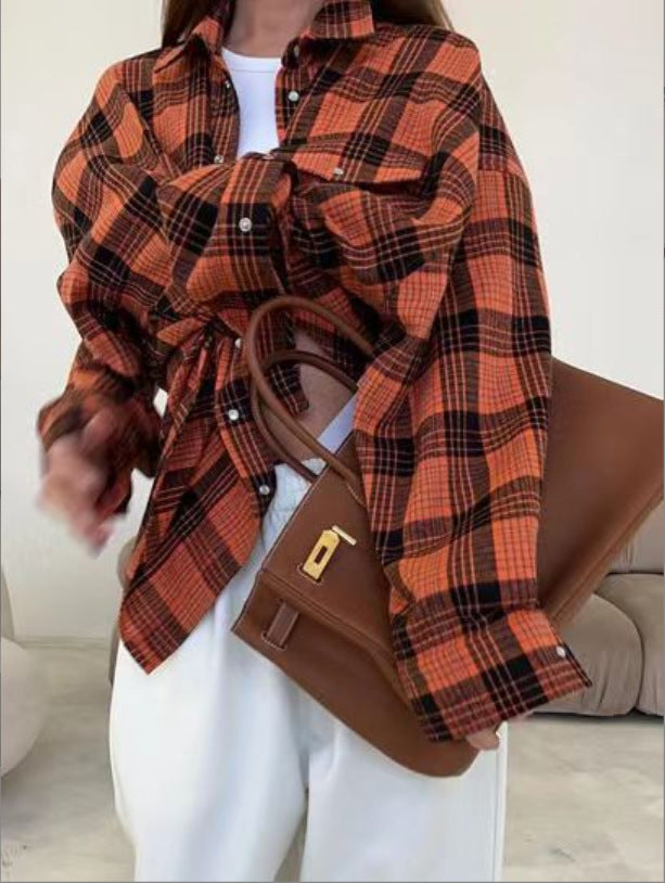 Casual oversized women's shirt, classic plaid pattern, comfortable & chic.