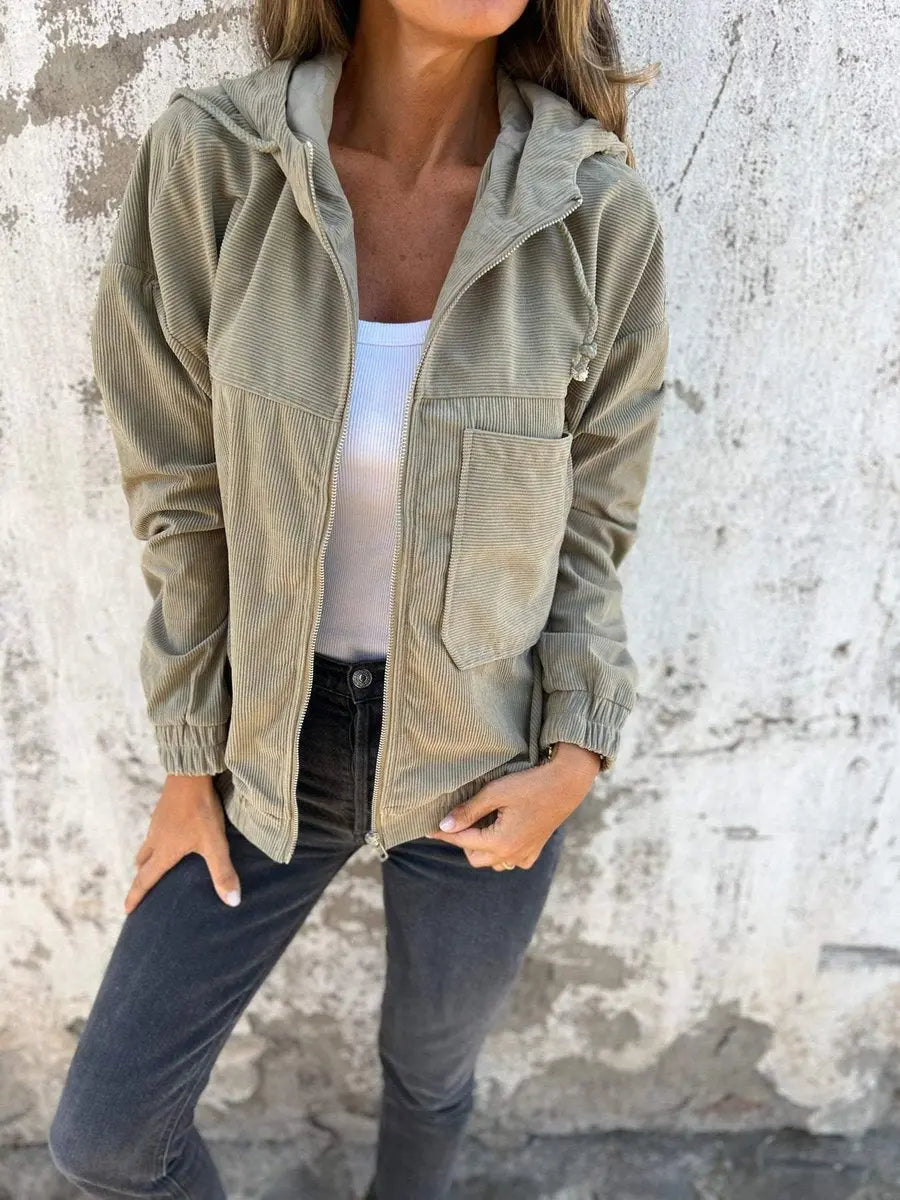 Fashionable women's oversized quilted corduroy jacket with hood & zip. Ideal casual outerwear for fall & spring layering.