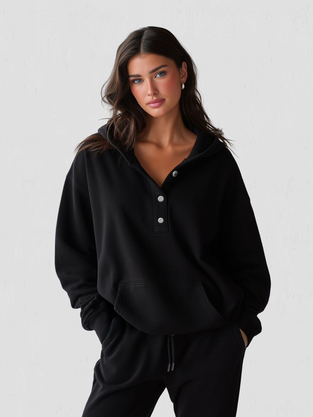 Chic and cozy women's oversized hoodie with a convenient snap-fit design for easy wear.