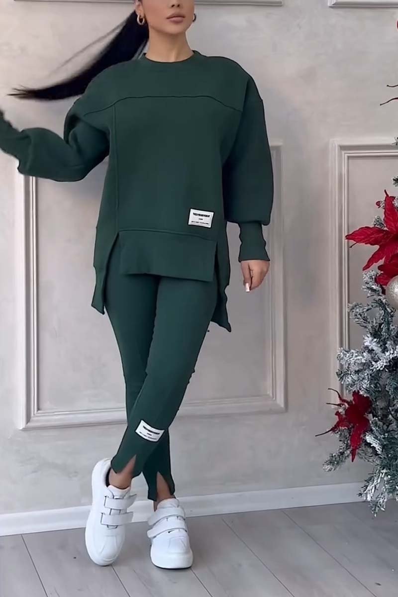 Woman relaxing in a comfortable oversized loungewear set; crew neck long sleeve top & leggings for cozy days.