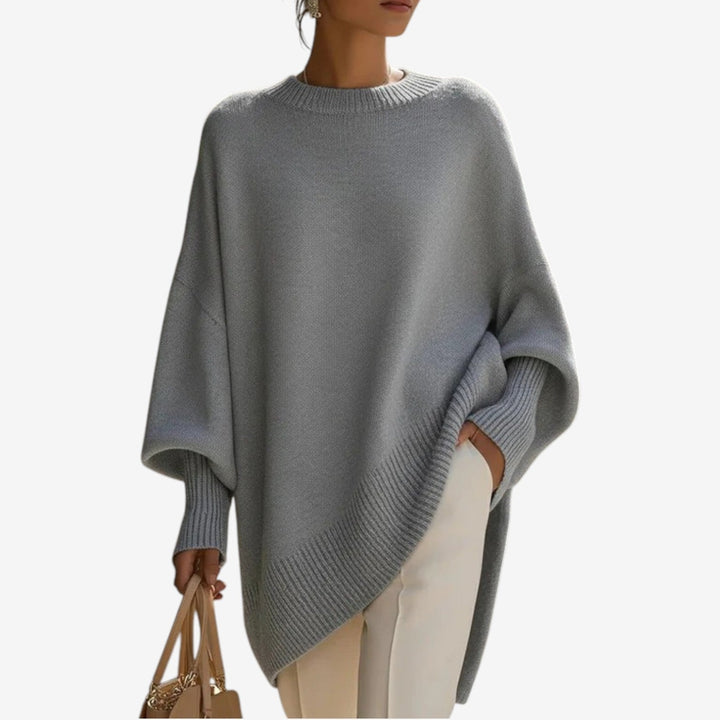 Comfortable women's batwing sleeve sweater, oversized fit, crew neck, asymmetric hem for relaxed chic style.