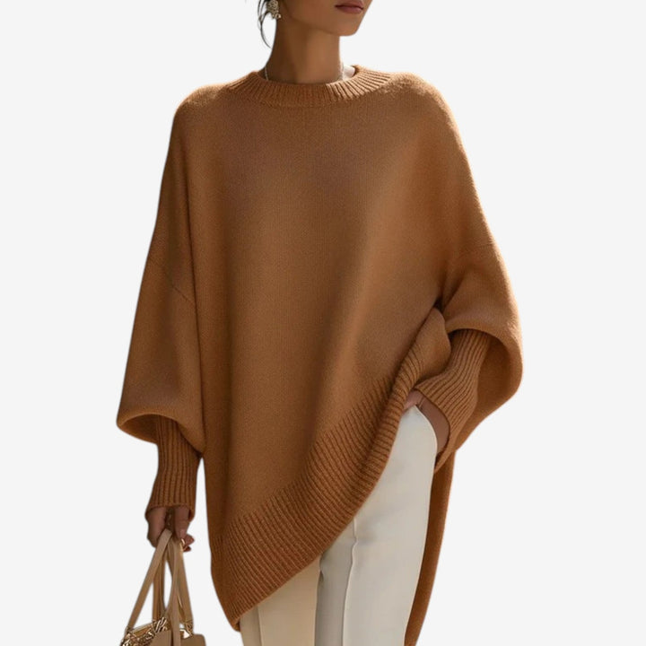 Versatile women's fall/winter sweater: oversized, batwing sleeve, crew neck, asymmetric hem for casual wear.