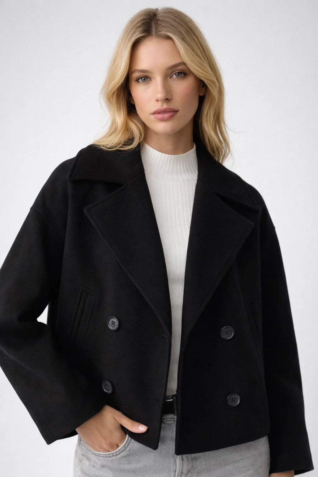 Stylish oversized women's short coat with double-breasted design, a classic and elegant outerwear piece.
