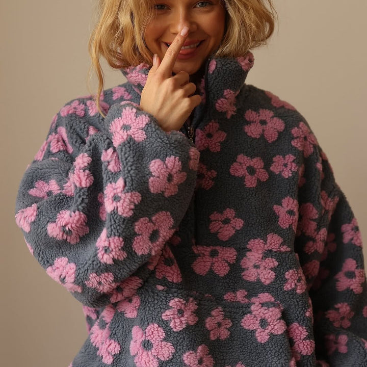 Cozy women's floral half-zip sweater jacket, oversized for comfortable winter style & casual wear.