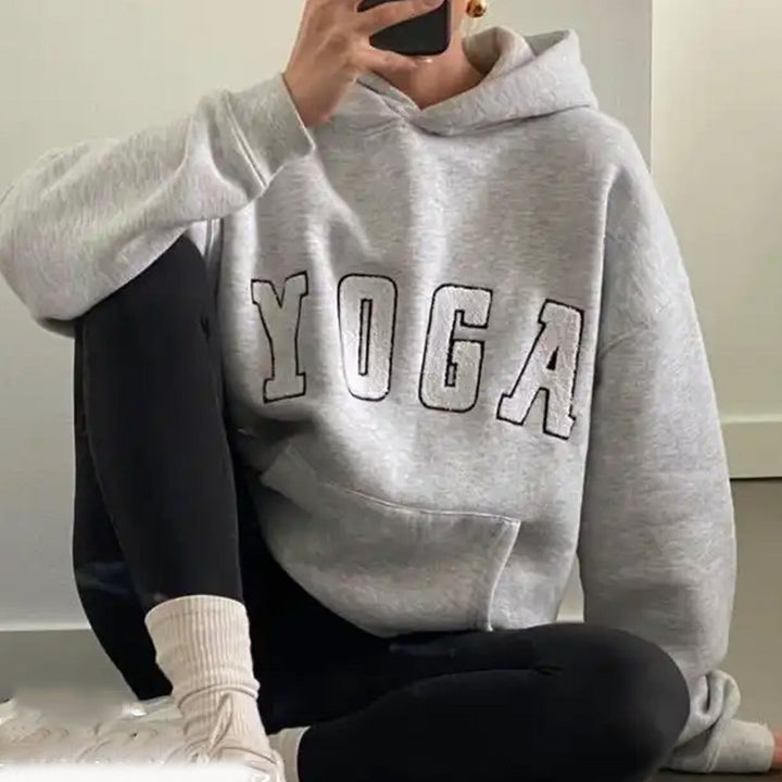 Comfortable women's sweatshirt featuring a unique yoga print, suitable for gym, casual outings or loungewear.