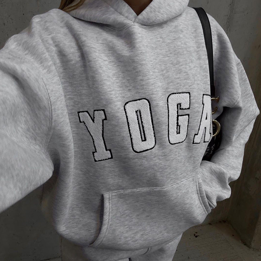Soft women's oversized gray yoga print hoodie, designed for ultimate comfort and relaxed athletic wear.