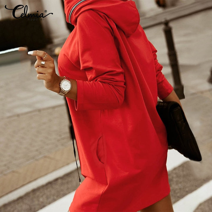 Modern women's oversized hoodie dress. Versatile zip detail, relaxed fit streetwear style, perfect for casual comfort.