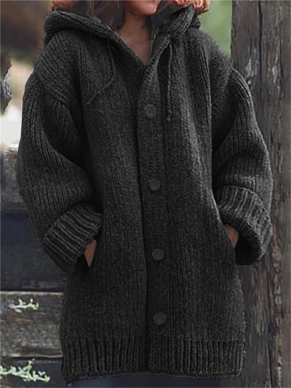Stylish women's hooded oversized knit cardigan. Soft, warm long-sleeve knitwear, ideal for fall & winter fashion.