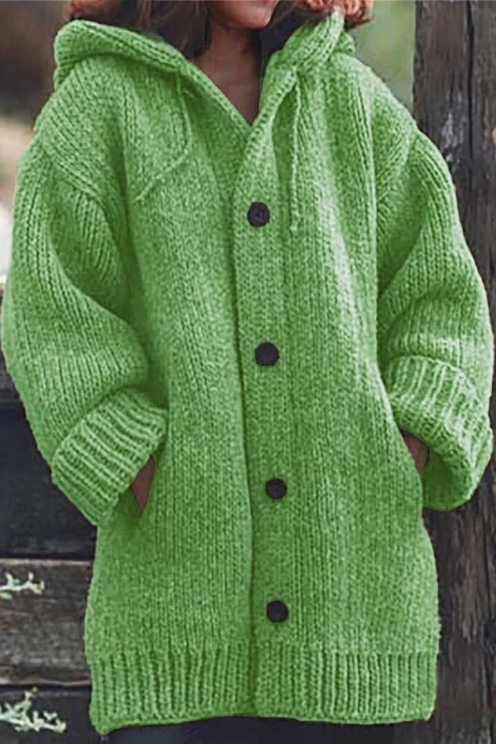 Soft knit hooded oversized women's cardigan. Cozy, comfortable long-sleeve sweater with pockets for stylish wear.
