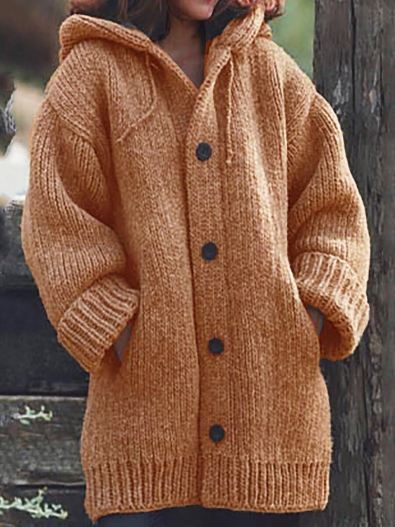 Women's oversized hooded knit cardigan. Comfortable and stylish long-sleeve knitwear, perfect for cozy fall outfits.