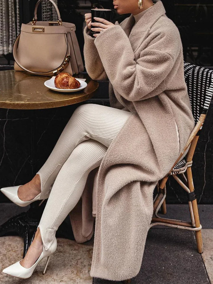 Modern women's oversized coat, featuring a sophisticated lapel design. Great as stylish winter outerwear or fall jacket.