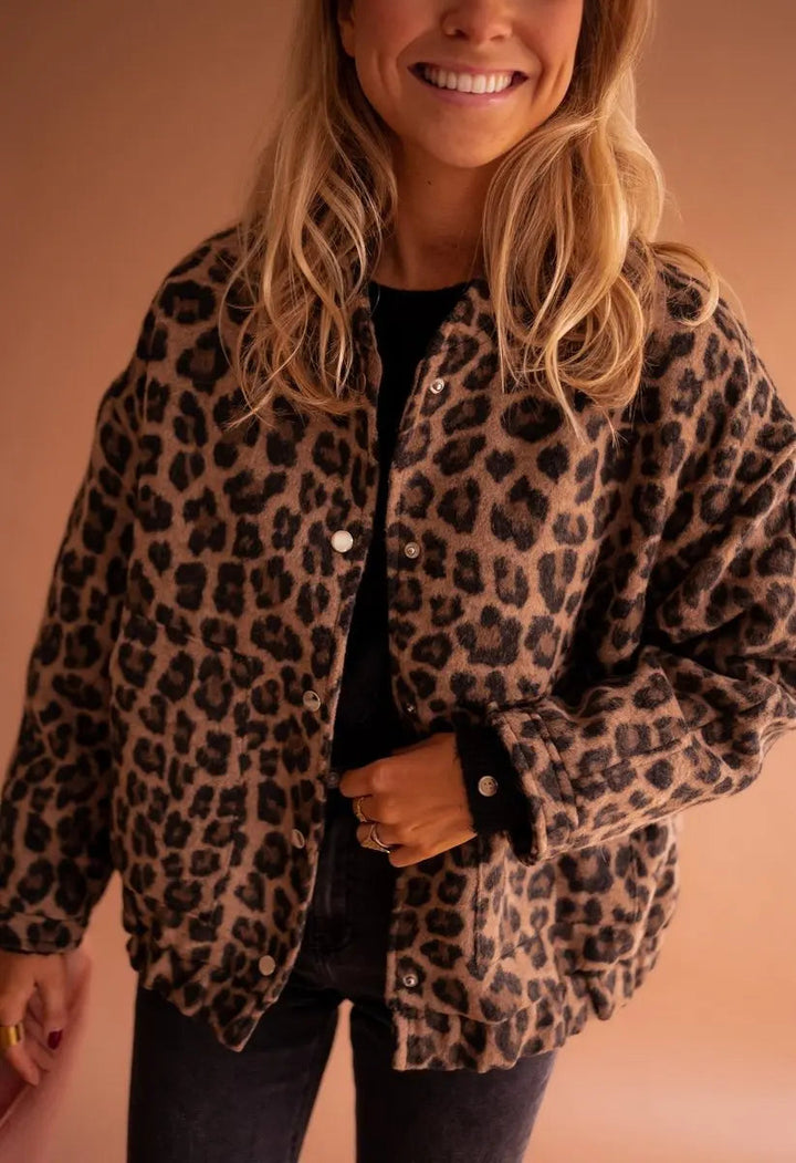 Women's oversized leopard print quilted jacket with stylish press-studs, perfect for fall fashion.