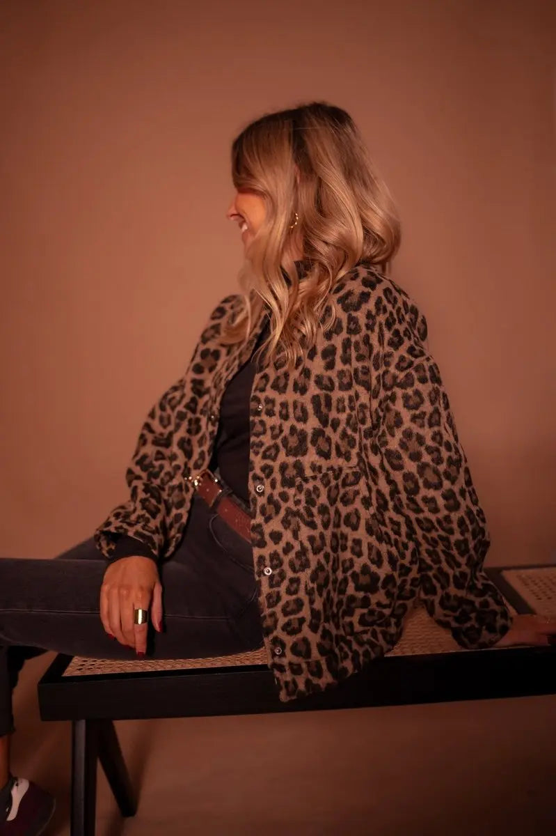 Casual women's leopard print oversized quilted jacket, designed with practical press-studs for everyday fashion.