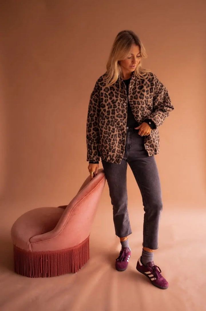 Stylish women's oversized leopard print quilted jacket with press-studs, ideal for chic fall outerwear.