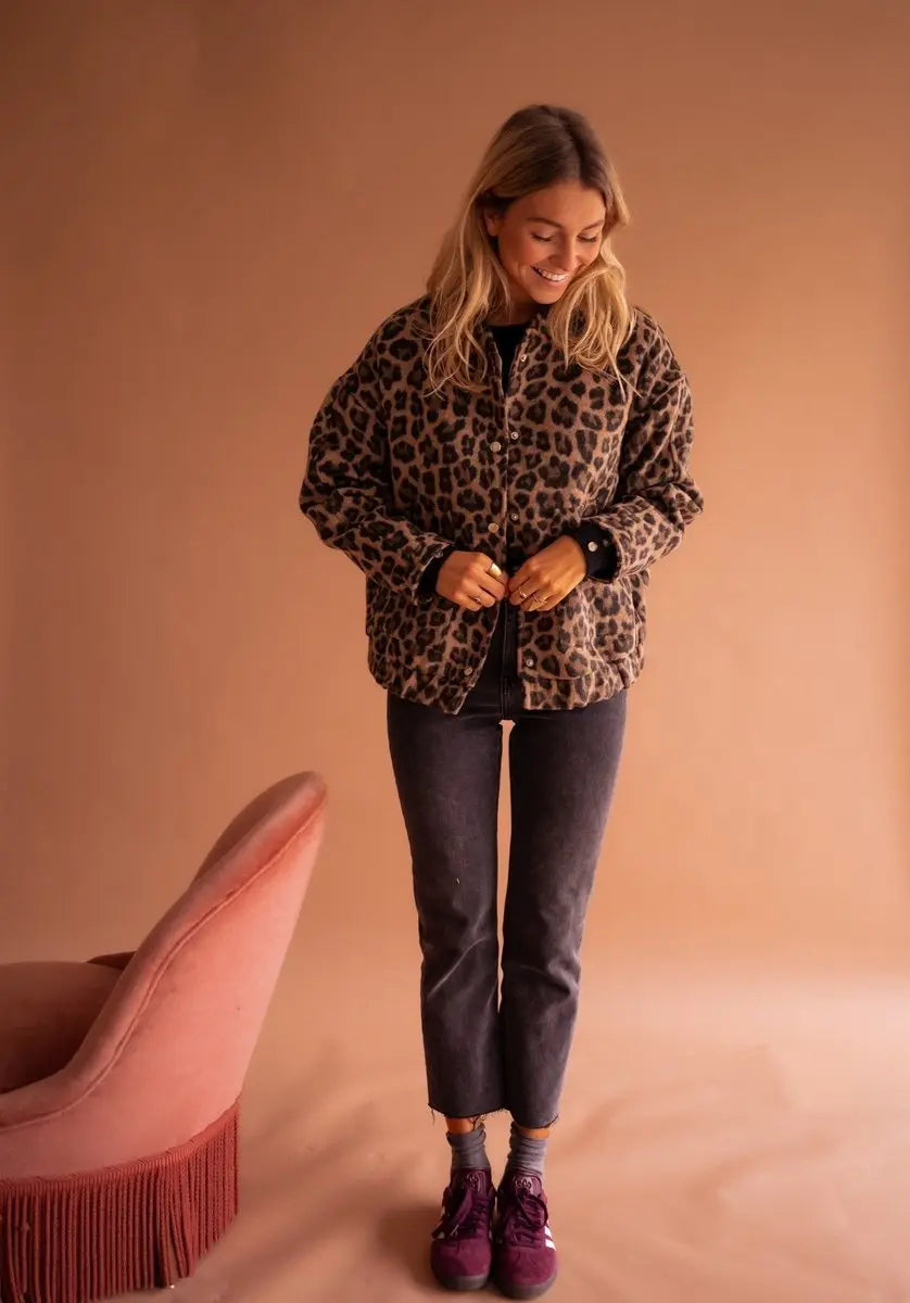 Women's oversized leopard print quilted jacket, collarless with press-studs, a stylish fall statement piece.