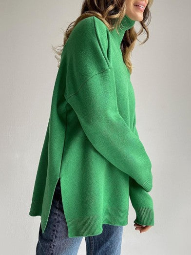 Women's oversized long turtleneck sweater with elegant side slit, perfect for cozy winter wear.