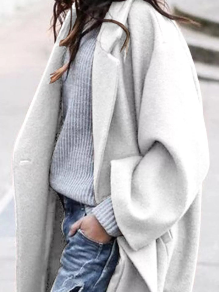 Fashionable women's oversized long winter coat, elegant, comfortable, and warm outerwear.