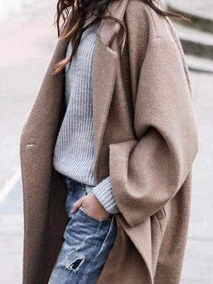 Elegant women's oversized long winter coat, stylish outerwear with a relaxed fit.