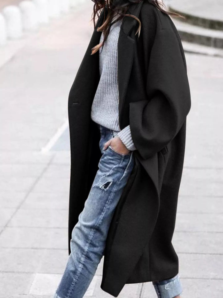 Black women's oversized long winter coat, elegant fashion for ultimate winter comfort.