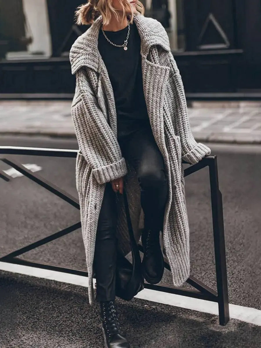Women's oversized longline cardigan with wide lapels, perfect for cozy winter layering and fashionable outerwear.
