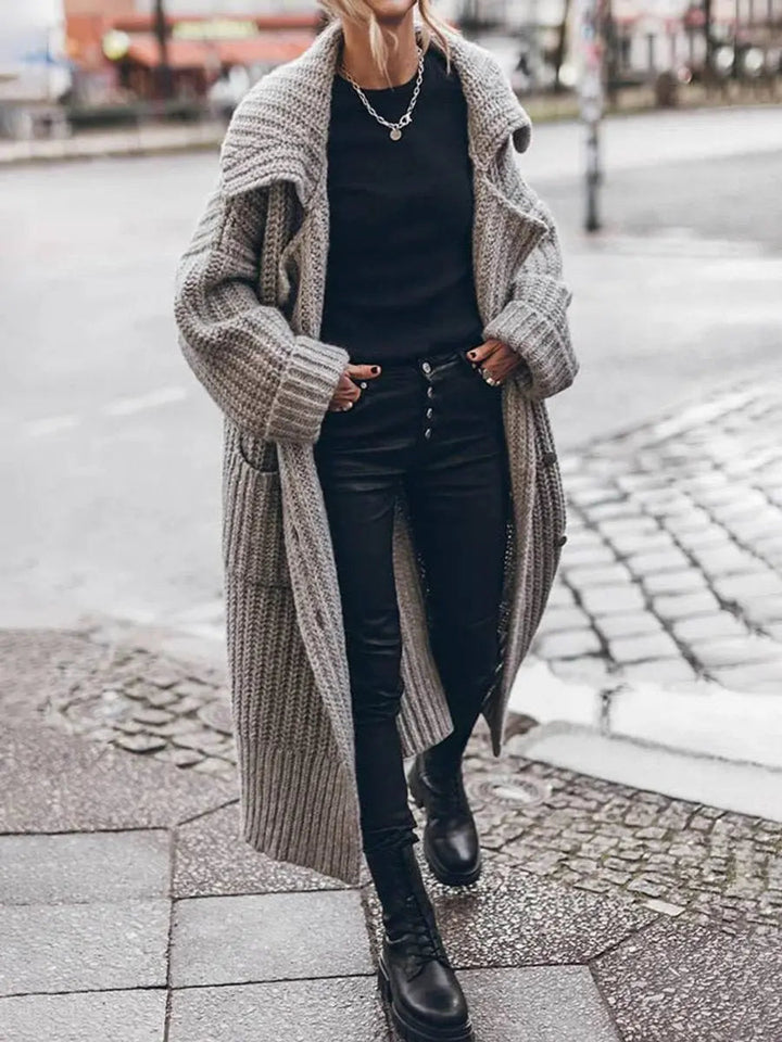 Stylish women's longline lapel cardigan, a versatile oversized outerwear piece for winter fashion and layering.
