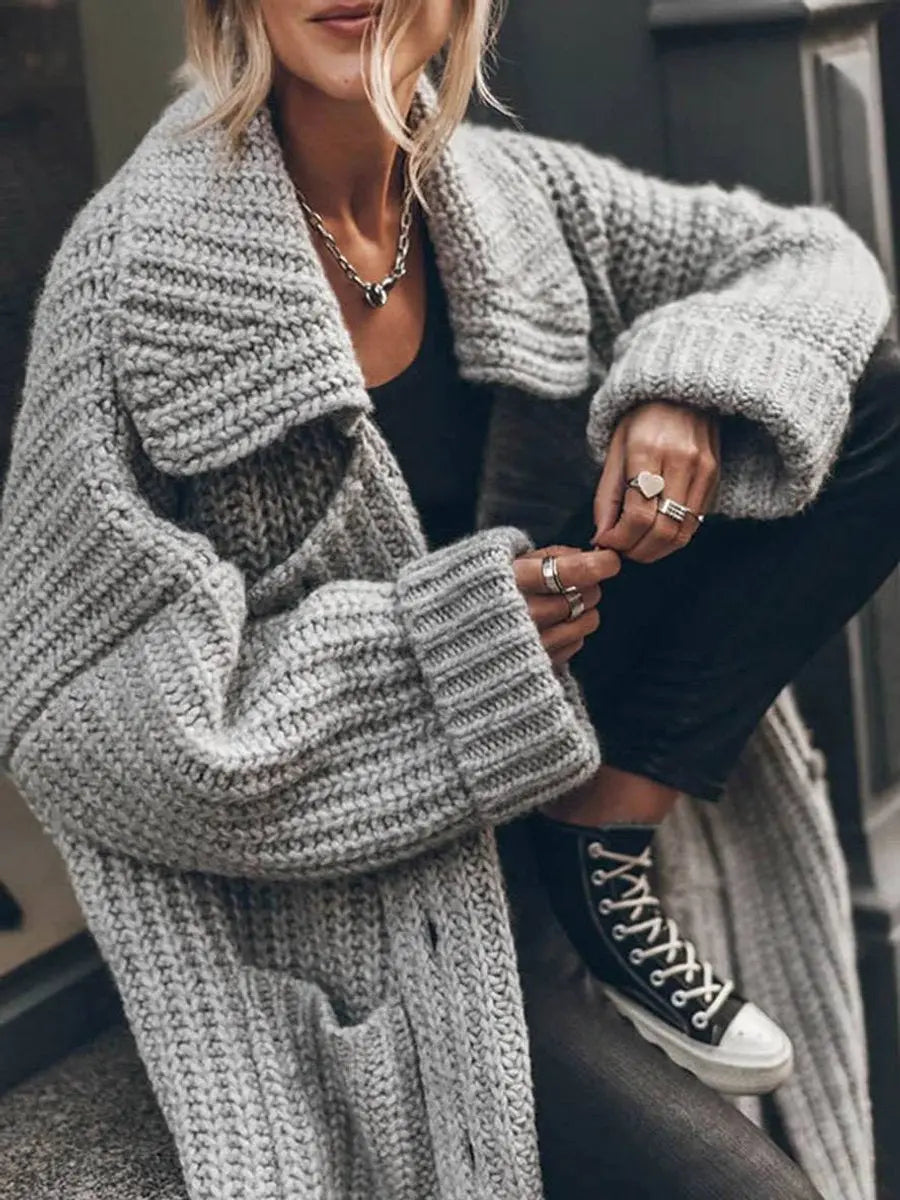 Cozy oversized women's cardigan with generous lapels, ideal longline outerwear for comfortable winter layering.