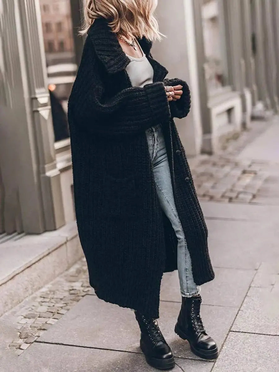 Fashionable women's longline cardigan, oversized with chic lapels, perfect for stylish winter outfits & comfortable layering.