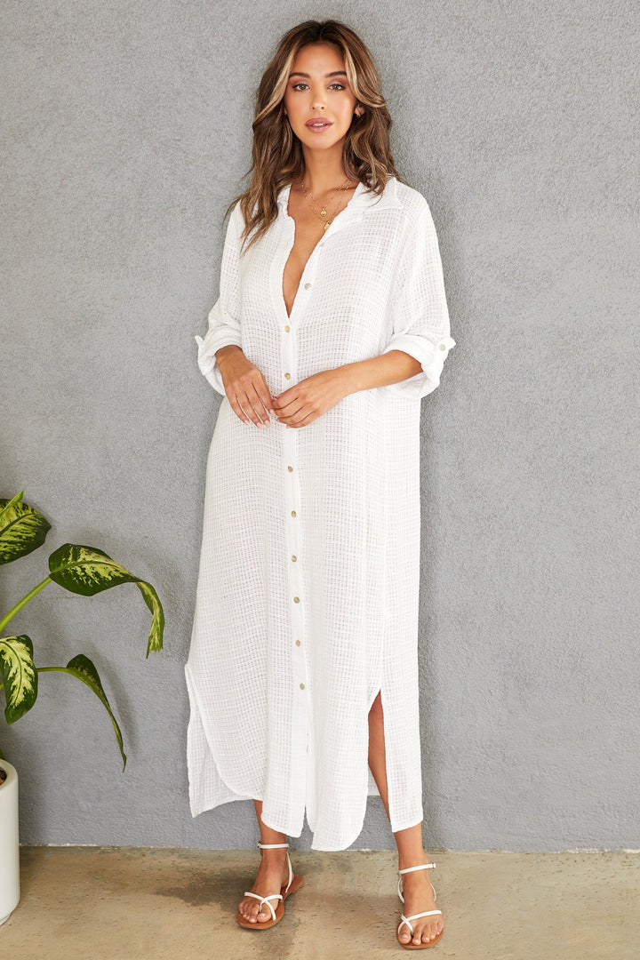 Chic button-down maxi dress with rolled sleeves, ideal for beach days