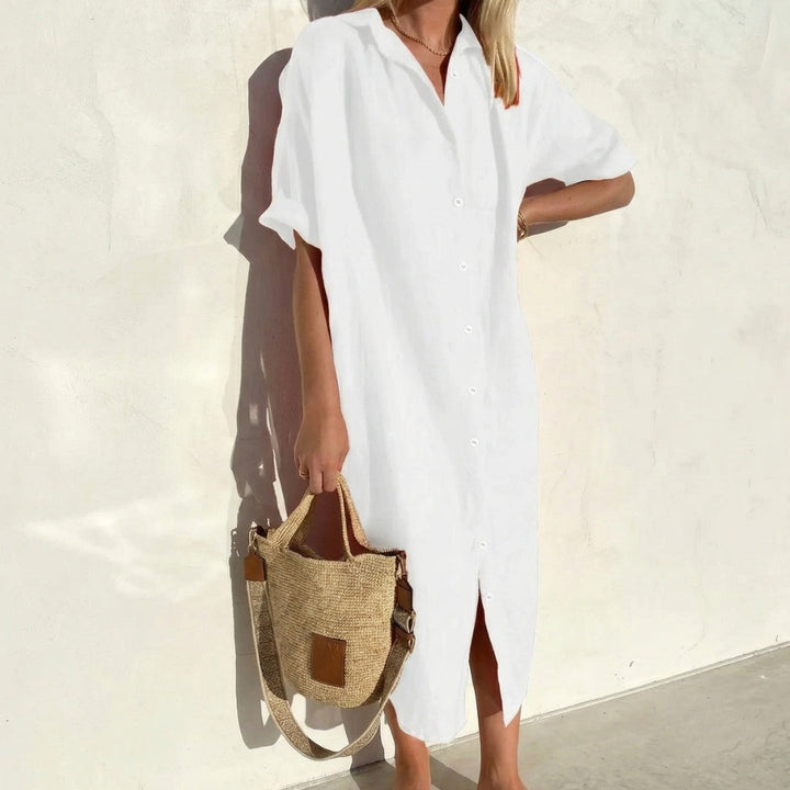 Relaxed fit women's midi shirt dress. Oversized, short-sleeve design for comfortable, casual wear.