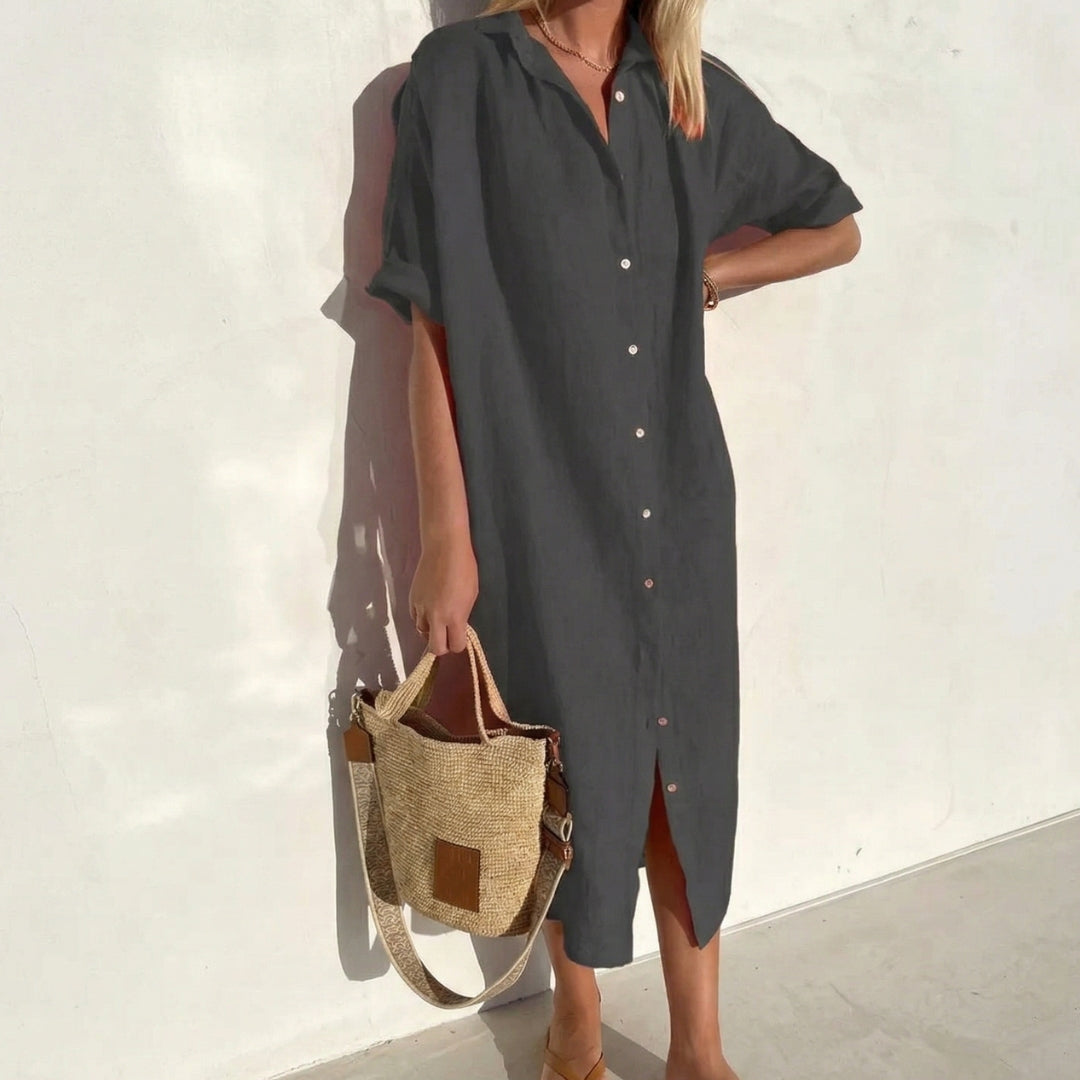 Button-front oversized midi shirt dress for women. Short sleeves & relaxed fit for everyday casual style.