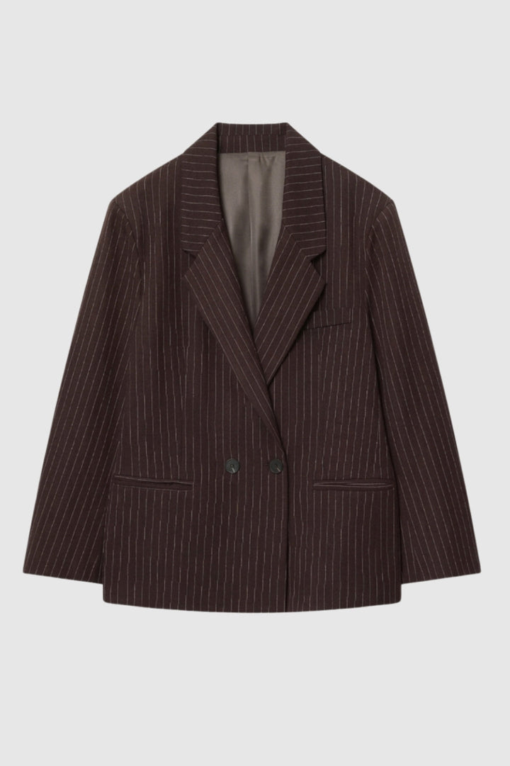 Stylish women's oversized pinstripe blazer. Double-breasted jacket with long sleeves, ideal for business attire.