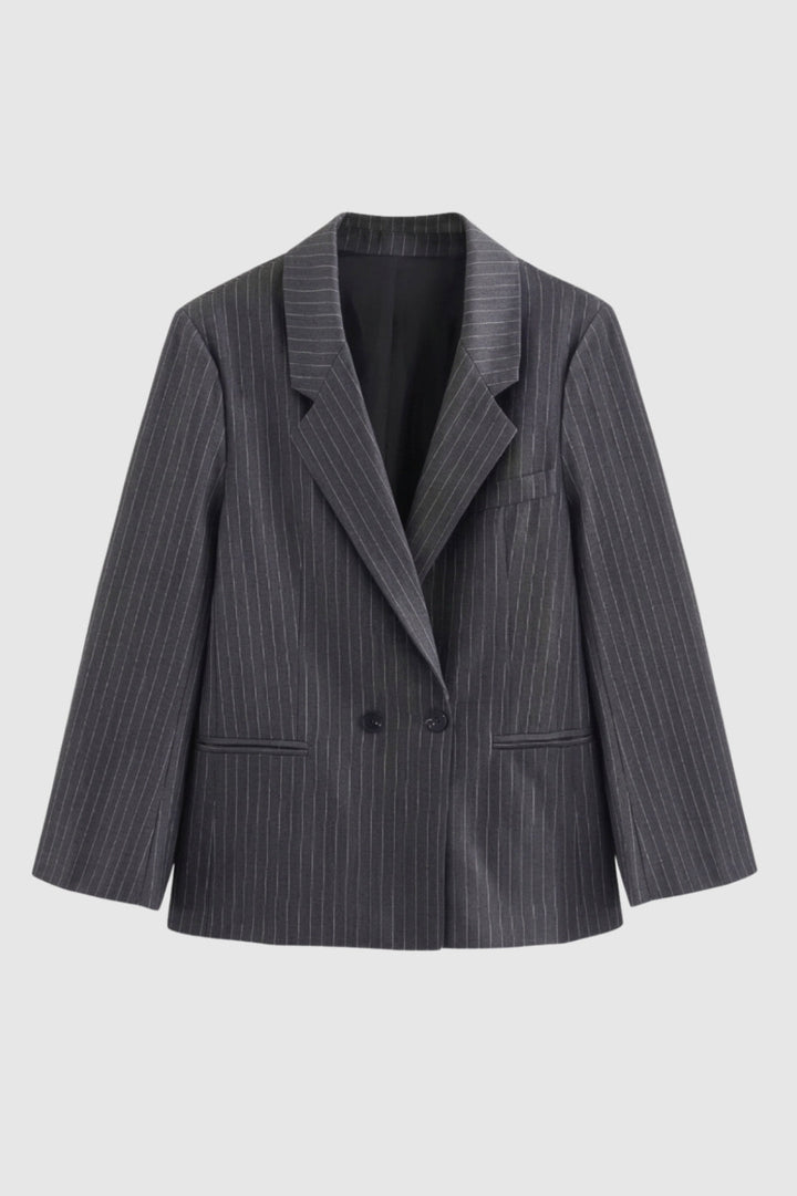 Elegant women's oversized pinstripe blazer. Structured long-sleeve double-breasted jacket for versatile smart casual looks.