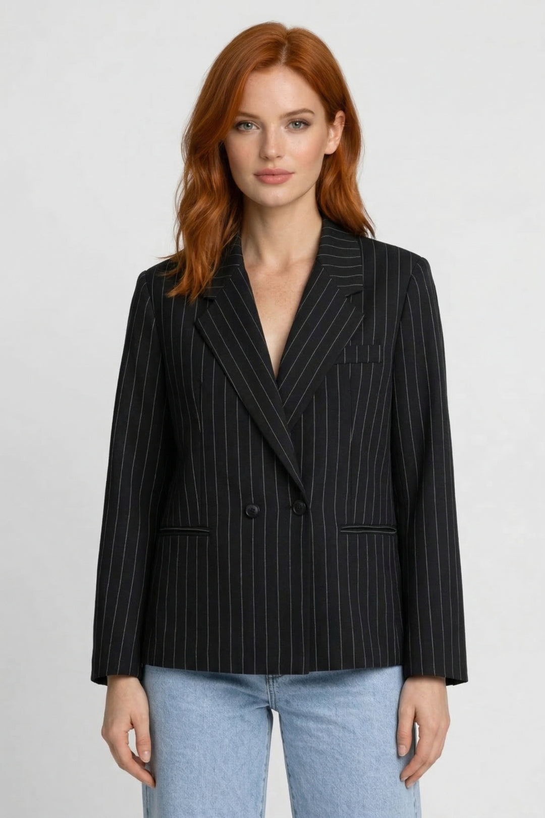Chic women's oversized pinstripe blazer. Smart casual fashion jacket, perfect for elevating office wear & business style.